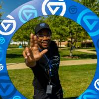 Man "anchoring up" with GVSU themed circle around him